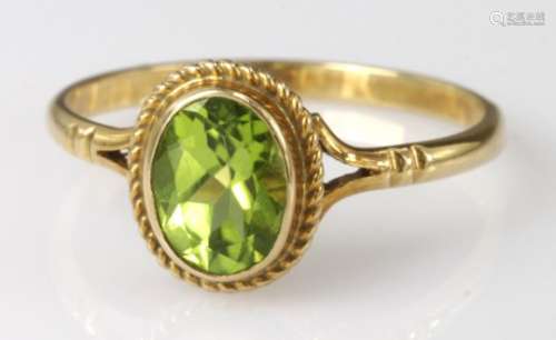 9ct yellow gold oval Peridot solitaire ring, finger size O, weight 1.8g
