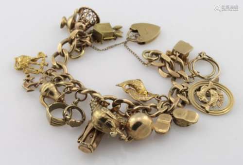 9ct charm bracelet with a good variety of charms attached, total weight 60.2g
