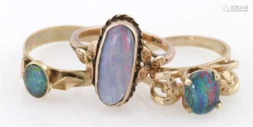 Three 9ct gold rings, one set with an opal doublet two more set with opal triplets, weight 7.8g