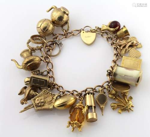 9ct charm bracelet with a good variety of charms attached, total weight 51.3g