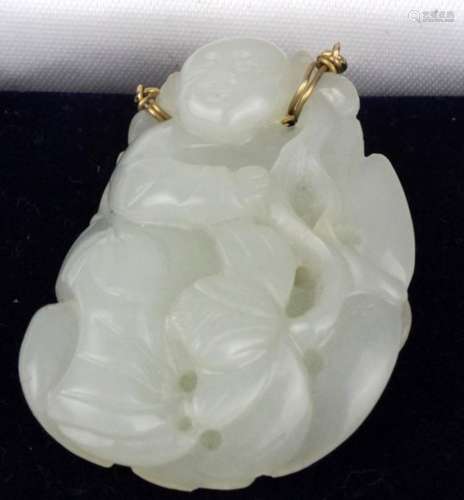 Jade. A carved jade pendant, depicting a buddha, 50mm x 32mm approx.