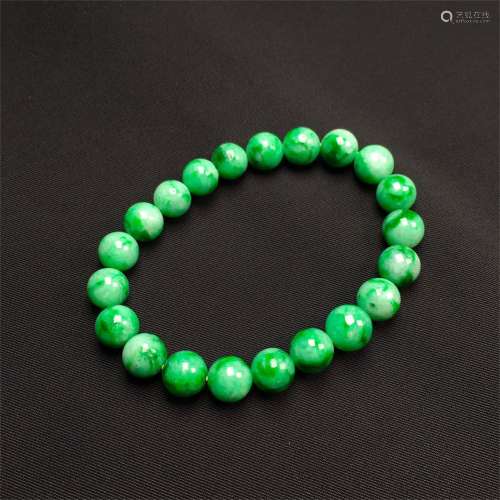 A Chinese Carved Jadeite Beads