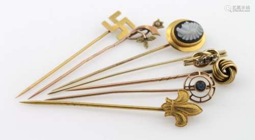 Seven gold/yellow metal hat pins. Total weight 9.5g