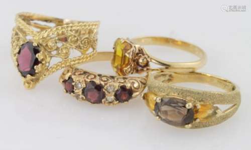 Four 9ct yellow gold gem set rings, weight 10.5g