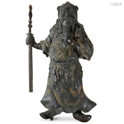 A Chinese style parcel-gilt bronze guardian figure,