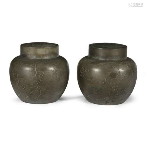 A pair of Chinese inscribed globular pewter tea