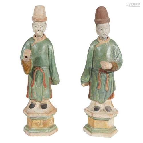 A pair of Chinese standing pottery figures, possibly