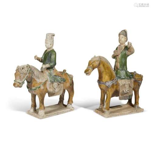 A pair of Chinese pottery horses and riders, possibly