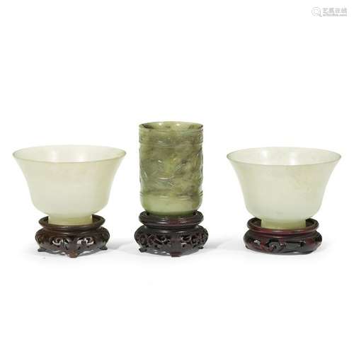 A Chinese spinach jade cup and two hardstone cups,