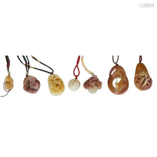 A group of seven Chinese carved soapstone pendants,