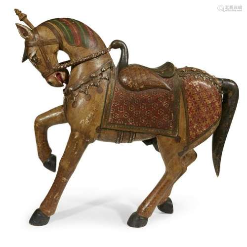 An Indian carved and painted wood model of a horse,