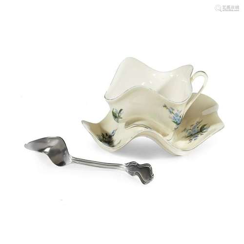 A Surrealist style teacup, saucer, and spoon by Robert