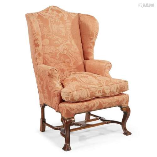 A George II style mahogany wingback chair upholstered