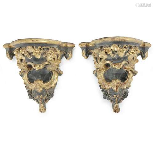 A pair of Baroque style parcel-gilt and ebonized
