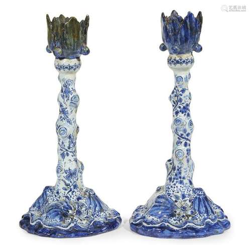 A pair of Dutch Delft candlesticks, likely 19th century