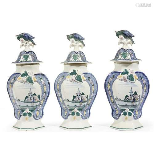 A set of three Dutch Delft jars and covers, 19th