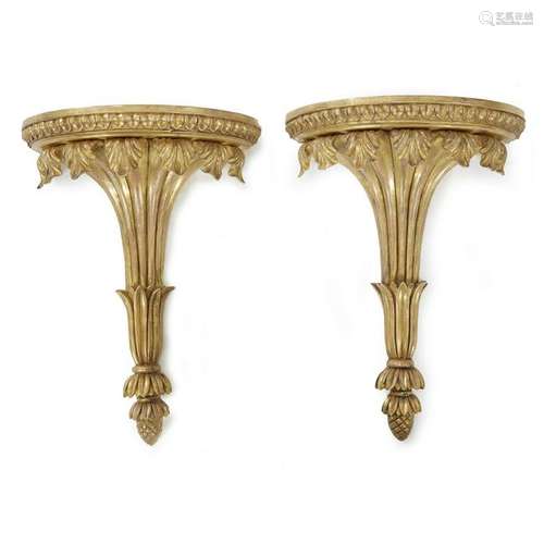 A pair of gilt George III style giltwood wall brackets,