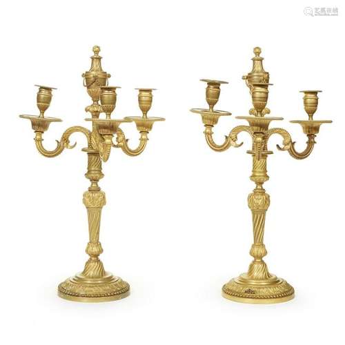 A pair of Louis XVI style gilt-bronze three-light