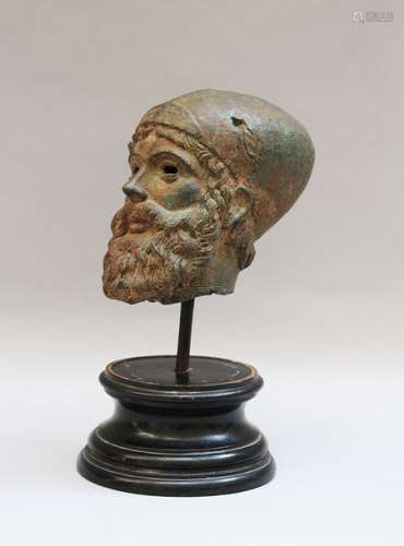 Male Bronze head of a bearded man with hat. Bronze…