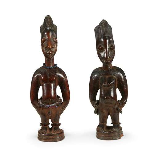 A pair of Yoruba ibeji figures, Nigeria Depicting a