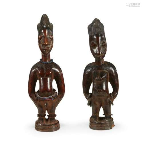 A pair of Yoruba ibeji figures, Nigeria Depicting a