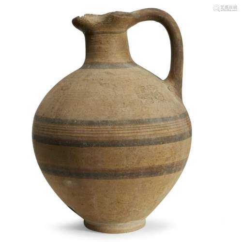 A Cypriot painted pottery ewer circa 1000 b.c. H: 10