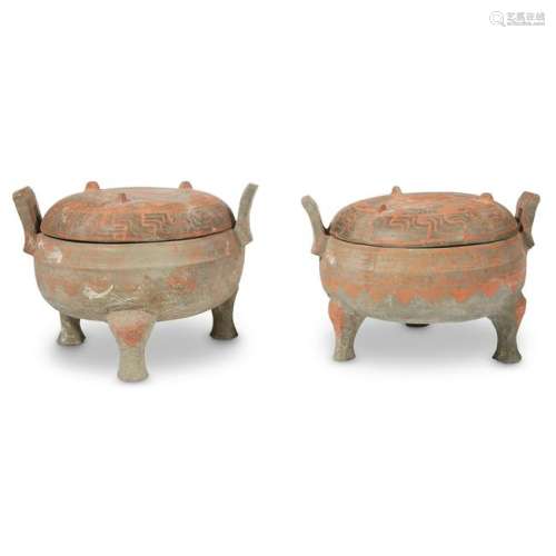 A pair of Chinese painted grey pottery covered tripod