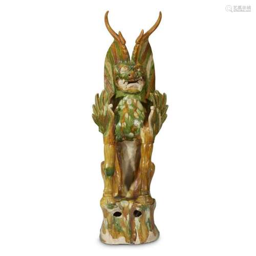 A Chinese sancai glazed figure of an earth spirit