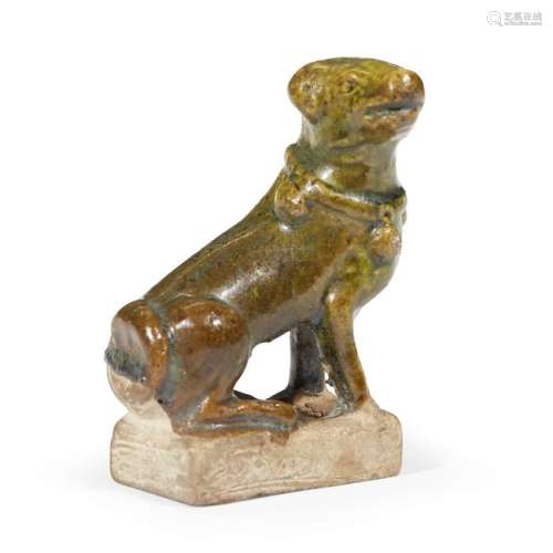 A Chinese green-glazed pottery figure of a seated hound