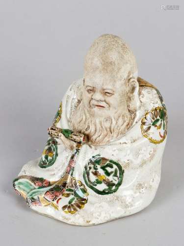 Chinese Porcelain figure of a wise men with script…