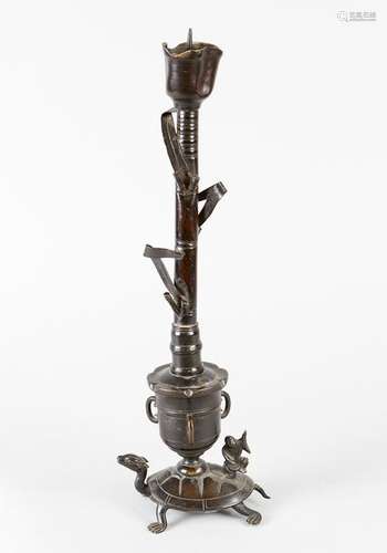 Asian candlestick in form of a flower with leaves …