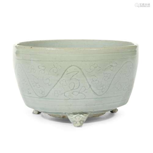 A Chinese incised Longquan celadon tripod censer ming