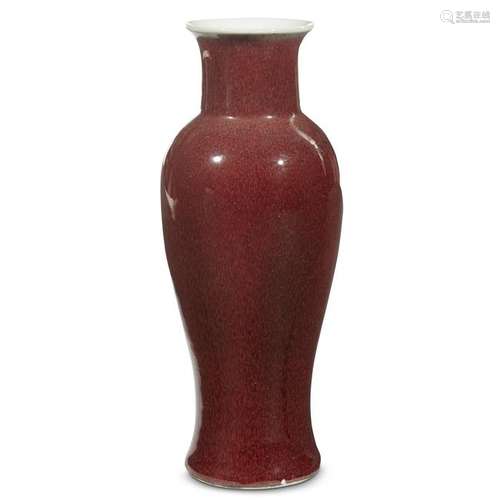 A Chinese copper-red glazed baluster vase. The slender