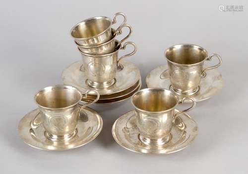Six silver cups and saucers . Each with handgrip, …