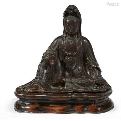 A Chinese lacquered wood figure of a seated Guanyin