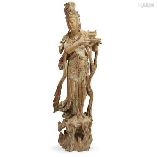 A large carved wood figure of a bodhisattva. Elegantly