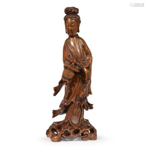 A Chinese carved boxwood figure of Guanyin. Depicted in