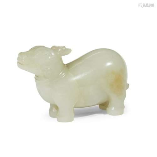 A small Chinese carved pale celadon jade tapirqing