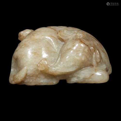 A Chinese small russett and beige carved jade group: