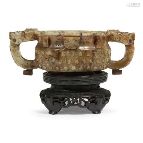 A Chinese archaistic gui-form grey and brown jade coupe