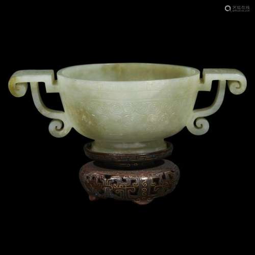 A Chinese celadon jade twin-handled archaistic libation