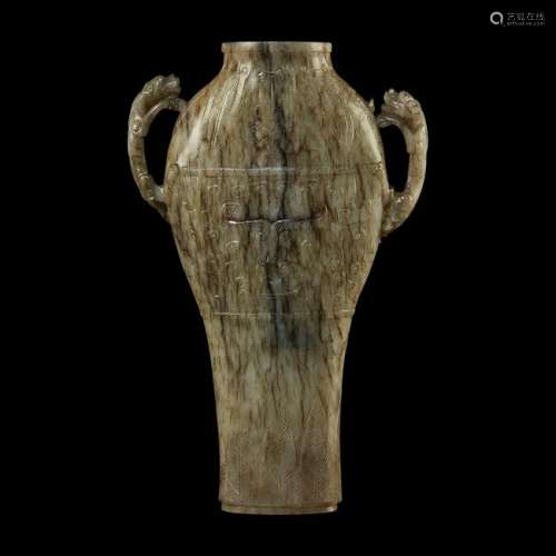 A Chinese carved grey and brown archaistic jade vase