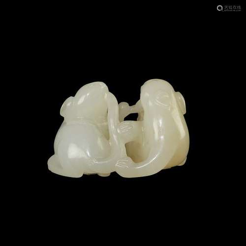 A Chinese small white jade carving of paired cats and a