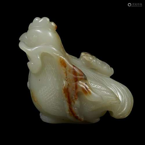 A Chinese pale celadon and russet jade carving of a