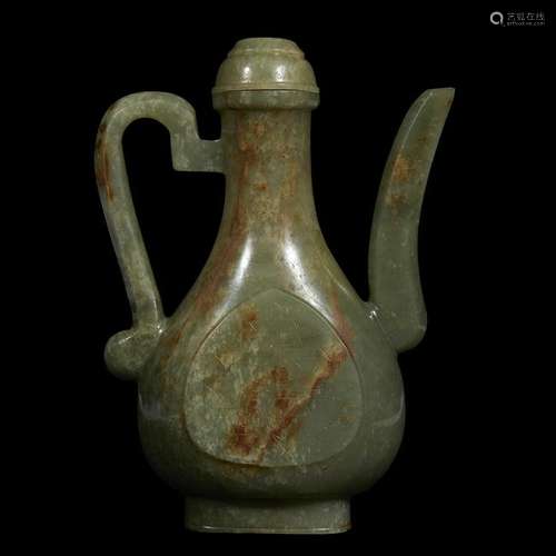 A Chinese carved celadon jade ewer and cover Ming