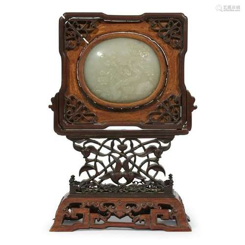 Chinese carved jade plaque in later carved wood stand