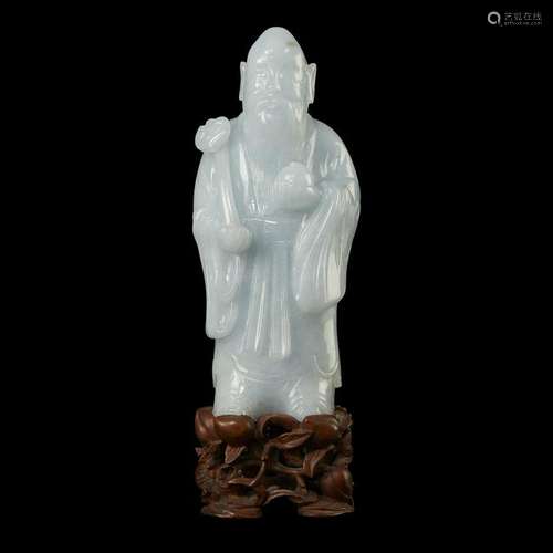 A Chinese carved pale greenish-white jadeite figure of