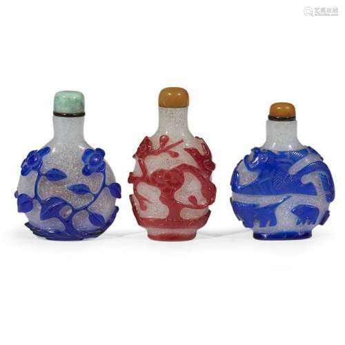 A group of three Chinese glass overlay snuff bottles.