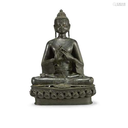 A Nepalese style patinated bronze seated Buddha.