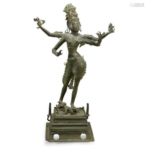 A large Indian bronze figure of standing Shiva.